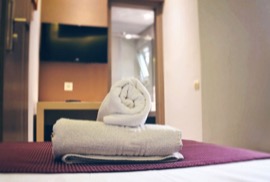 A close up of the bed in a Deluxe Single Room